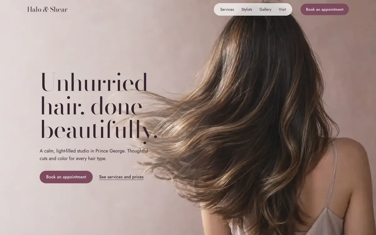 Halo & Shear Studio home page: an elegant serif headline beside long, glossy hair in motion